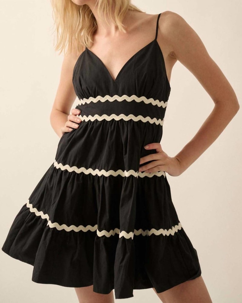 Front of a model wearing a size L Solid Rickrack Trimmed Tiered Mini Sundress In Black in Black by PROMESA. | dia_product_style_image_id:342425